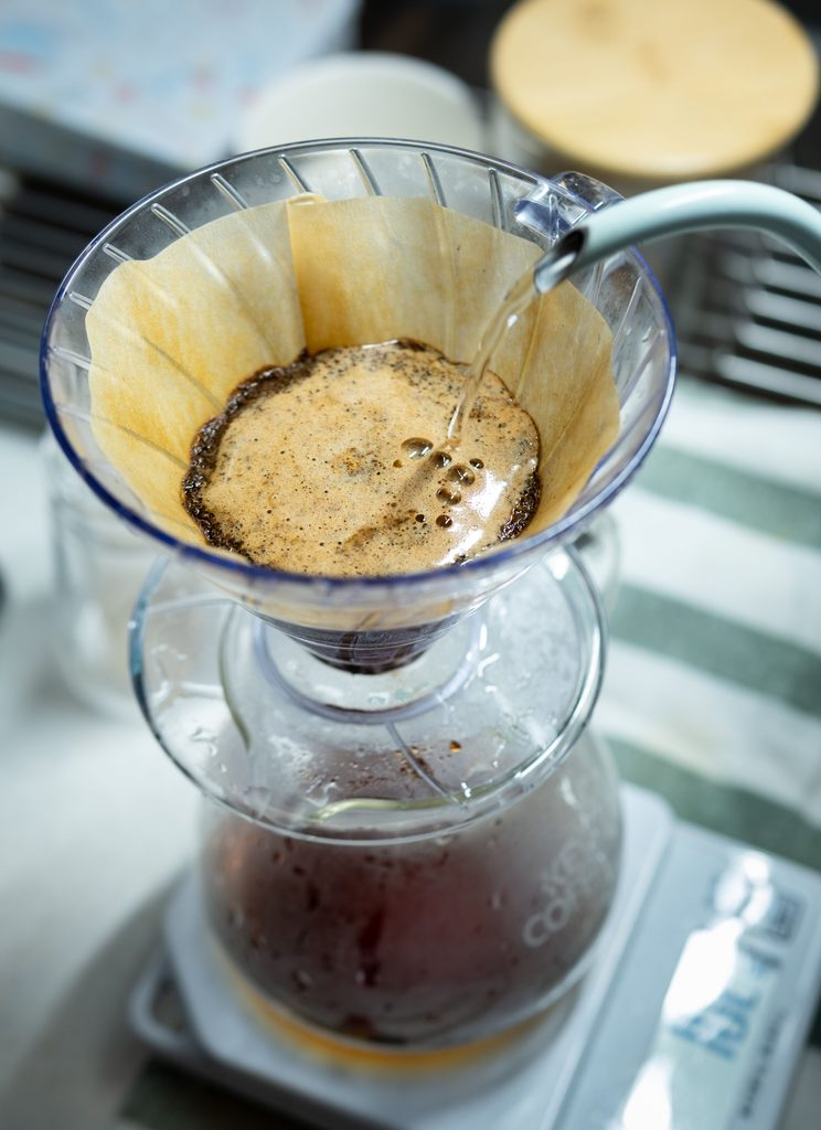 pour-over coffee blooming in a filter